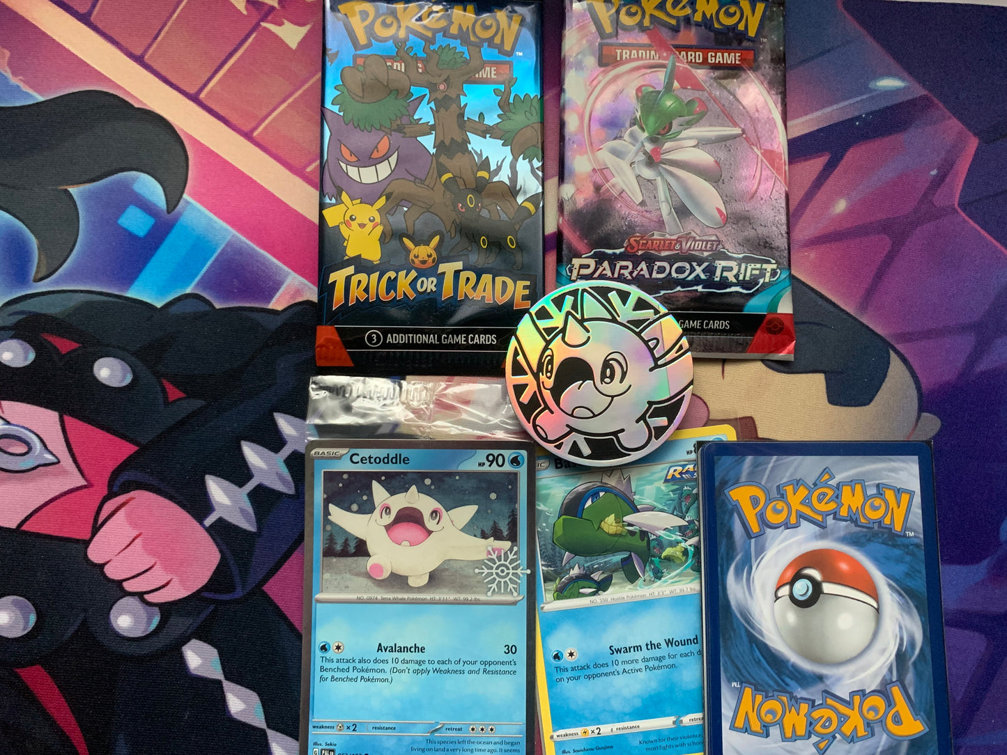 Bundle 3: 2 sealed Pokémon packs, 1 rare/sealed card, 5/4 bonus sleeved Pokémon cards,1 Pokémon coin